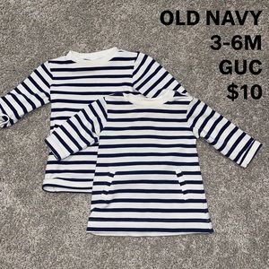 Twin girl matching striped navy and white dresses